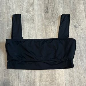 Black Billabong swim top - never worn. Size M.